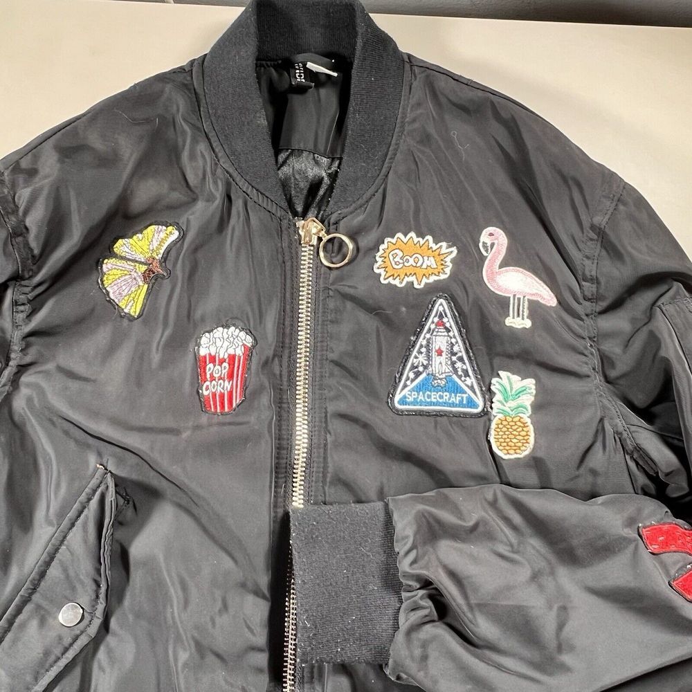 H&M Divided Womens Black Patch Bomber Jacket Space Flamingo Popcorn Size‎ 12